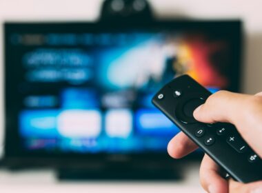 turned-on flat screen television