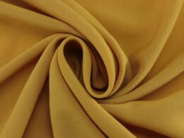 Yellow Crepe fabric ( toasted yellow, mustard yellow), lightweight and thin. Ideal for making blouses, scarves, dresses and fabric skirts. - @divazus