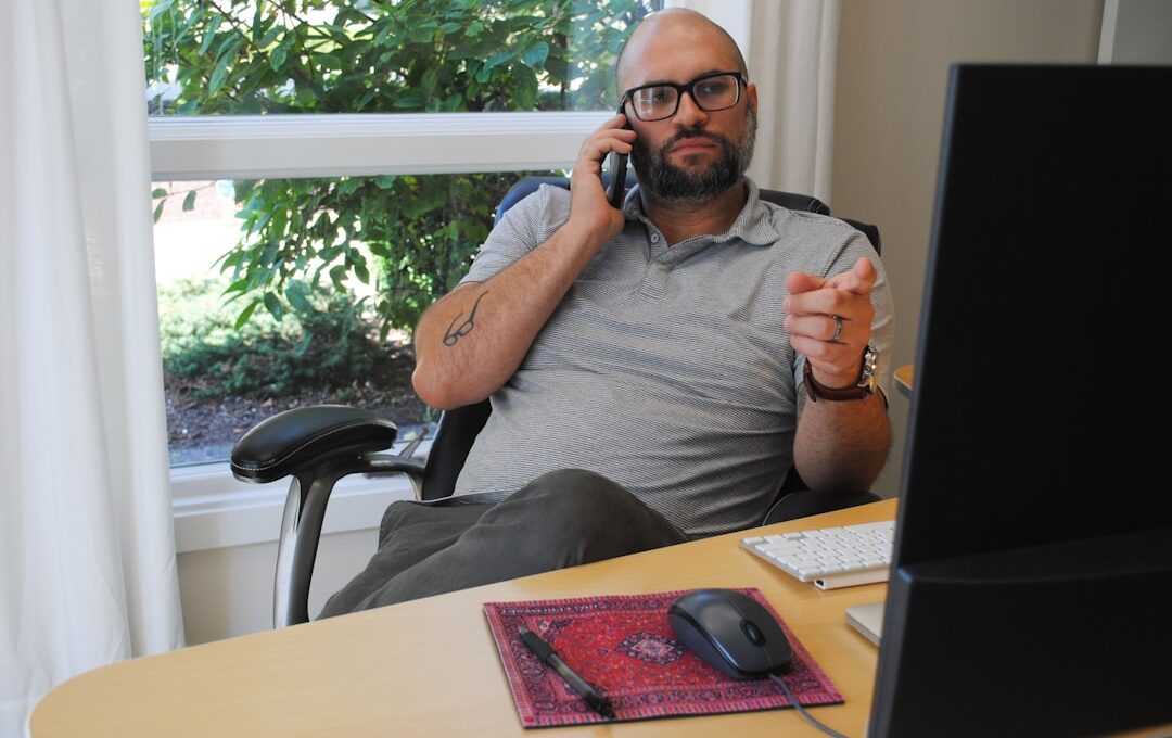 Man talking on the phone during marketing meeting.