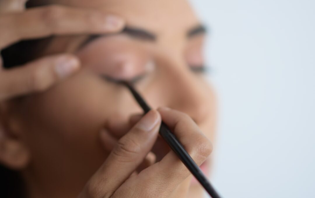 Makeup Artist working in the eyes