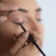 Makeup Artist working in the eyes